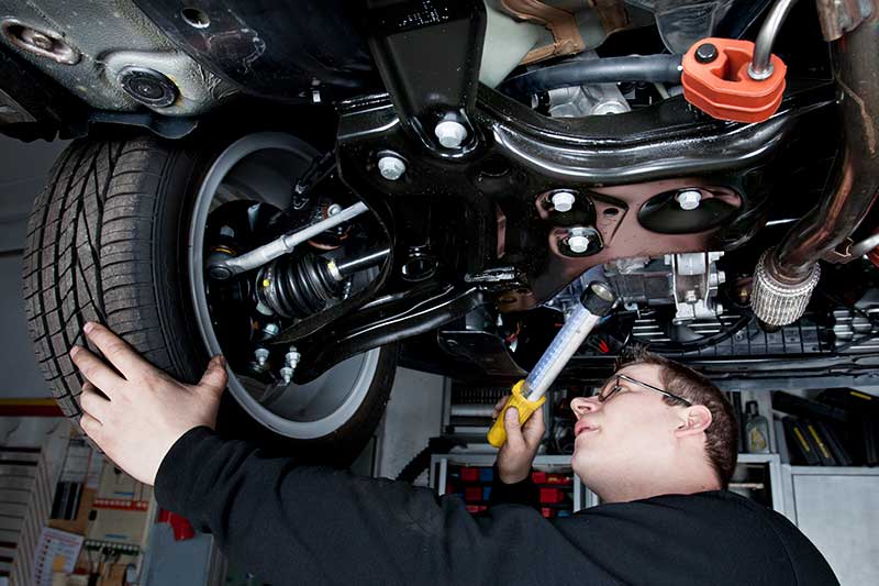 RS764251_GettyImages-155375668 adjusting wheel alignment on car